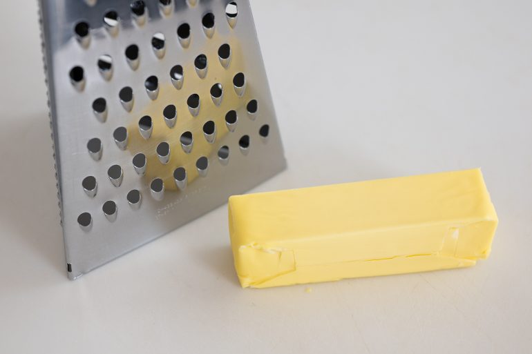 A stick of butter and a box grater.