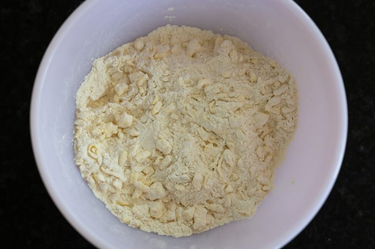 Butter mixed into a flour mixture.