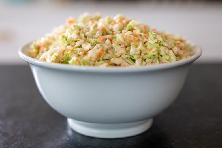 A bowl of coleslaw.
